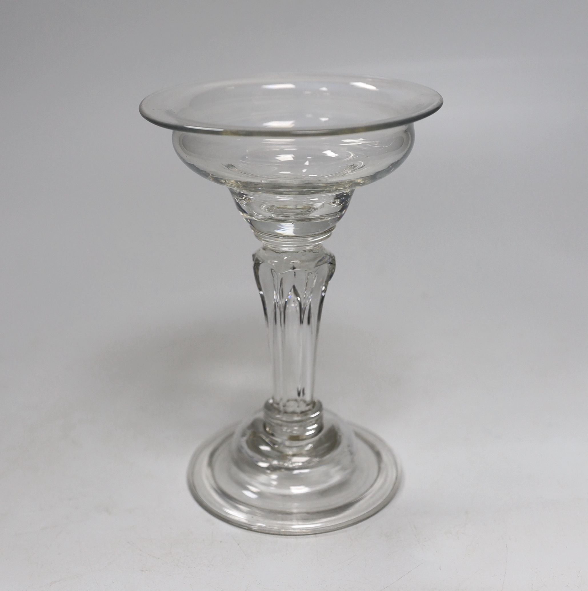 An English lead crystal champagne or sweetmeat glass, c.1745, flat double ogee bowl with everted rim, on double collar, eight sided Silesian stem on double collar, domed, folded foot, rough pontil, 15.6cm high